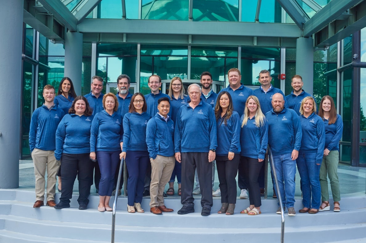 The full Cukierski team standing in front of office exterior